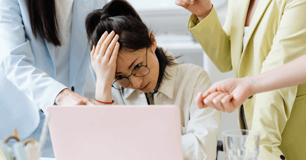 a woman who seems stressed, looking at her screen for an article on the effects blood test delays can have on one's mental wellbeing