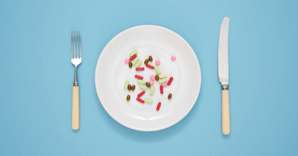 an image of a dinner plate with various capsules on it for an article about biohacking