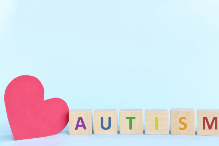 An image of the word autism spelled with different coloured building blocks