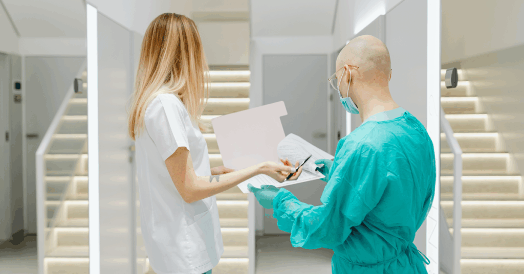 image of a doctor and a member of staff going through paperwork